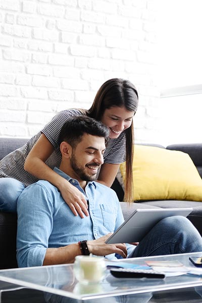 family on laptop on couch